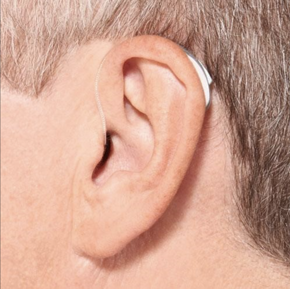 Receiver-in-Canal (RIC) hearing aid worn on an ear